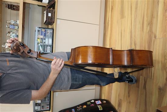 A cased cello with bow